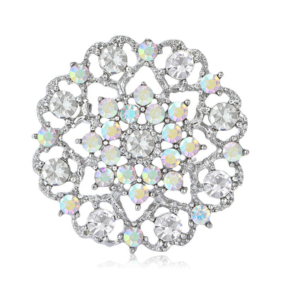 Silver openwork crystal sunflower brooch on white