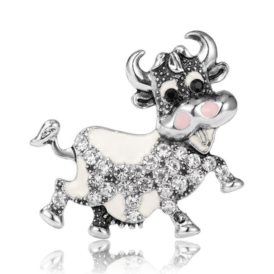 Front view of playful ox figure covered with clear crystals and enamel accents