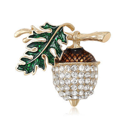 Front view of the acorn and oak leaf brooch showing a crystal-covered acorn with green enamel oak leaves