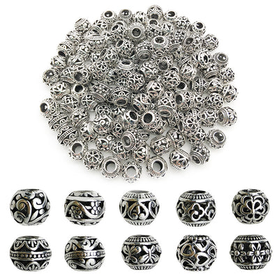 Metallic spacer bead beads arranged on a light background