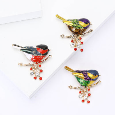 Enamel Bird Branch Brooch shown alone on a light background