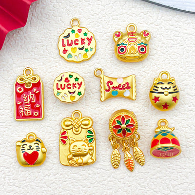 Metallic cake charms arranged on a light background