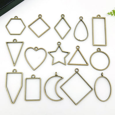 Metallic star and heart charms arranged on a light background