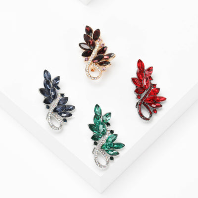 Front view showing the crystal leaf spray brooch in four faceted color variations