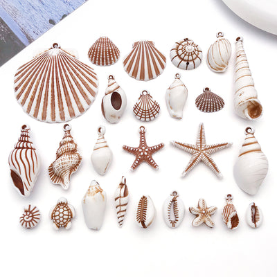Brown seashell and starfish charms arranged on a light background
