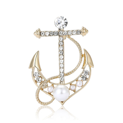 Gold pearl rhinestone anchor brooch front on white