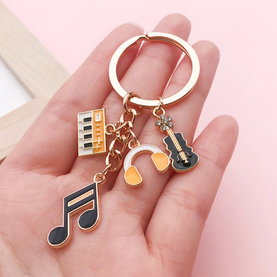Image 1 showing a person holding up some musical items.