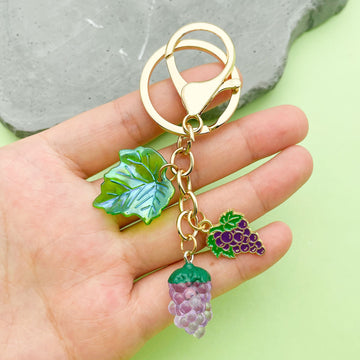 Strawberry, Cherry and Lemon Charm Keychains Featuring Purple Grape Across 43 Variations