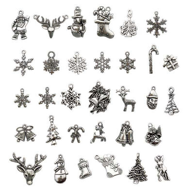 Metallic assorted shape charms arranged on a light background