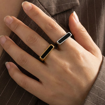 Gold and steel square black bar geometric rings worn stacked