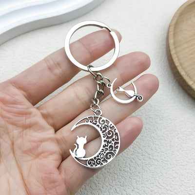 Image 1 showing a person holding a silver keychain.