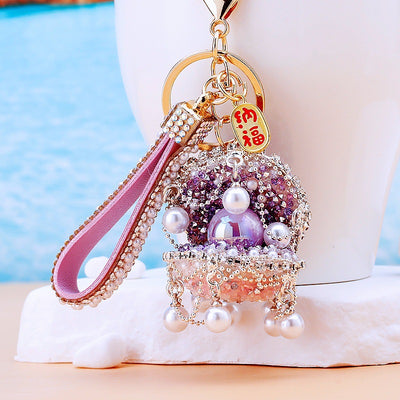 Main image 1 shows a supplied presentation of jeweled treasure shell keychains with visible attached key hardware.