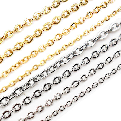 flattened oval link metal chain arranged together on a white background