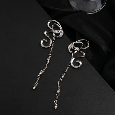 Silver abstract butterfly ribbon earrings with long crystal chain tassels on black