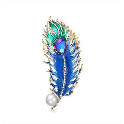 Front product view of the peacock brooch pin in blue and gold