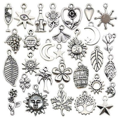 Metallic moon and sun charms arranged on a light background