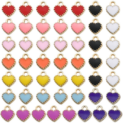 Colorful heart charms arranged on a light background