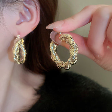 Gold Tone Textured Open Hoop Earrings with Polished Metal Finish