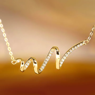 Gold tone wave bar pendant necklace pave CZ close-up