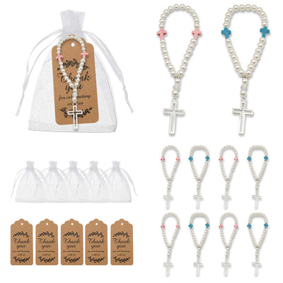 A packaged pearl cross bracelet appears beside loose pink and blue versions, white drawstring bags, and thank-you tags.