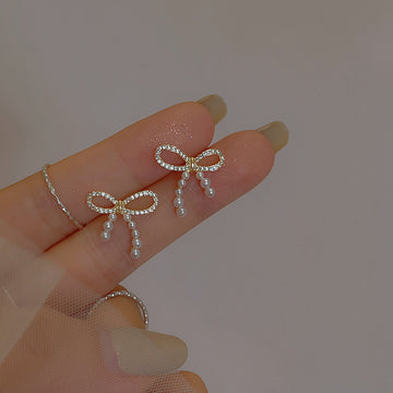 Gold Tone Crystal Bow Stud Earrings With Pearl Drops