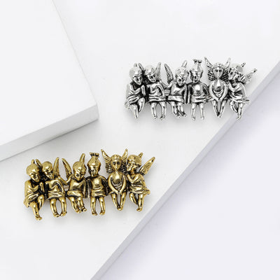 Gold and silver six angels bench brooches together