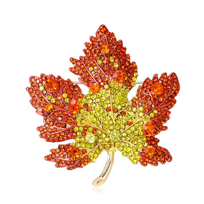 Front view showing the crystal maple leaf brooch in seven gradient color variations