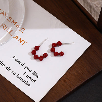 Primary supplied view of red beaded crescent studs