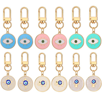 Twelve Piece Gold Tone Round Elephant and Evil Eye Clip Keychain Set