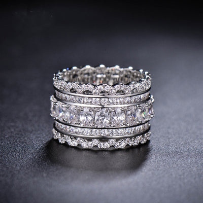 Product view showing silver-tone square and round clear-stone five-row extra-wide ring