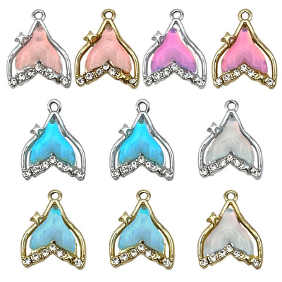 Colorful assorted shape charms arranged on a light background
