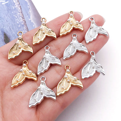 Red assorted shape charms arranged on a light background