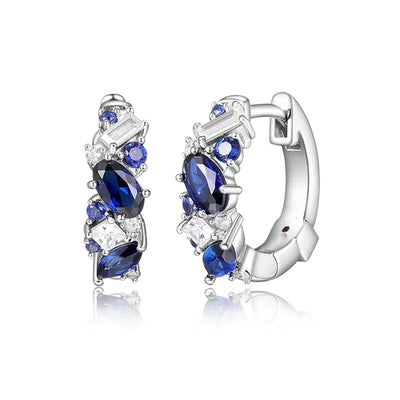 Product view showing blue mixed-cut stone small hoop earrings in silver tone