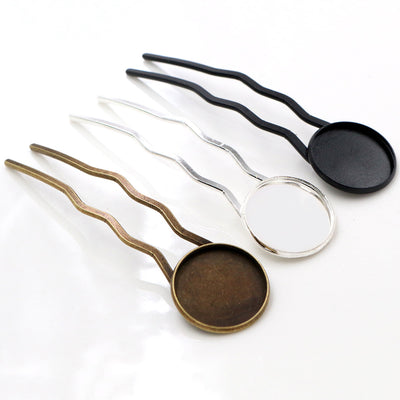 Assorted wavy two-prong hair fork blanks with round cabochon trays arranged together in the main product view