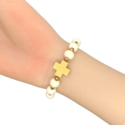 Wood bead cross bracelet worn on wrist