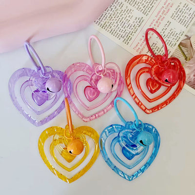 Main product view of translucent Nested Heart Bell Charms in Five Bright Colors