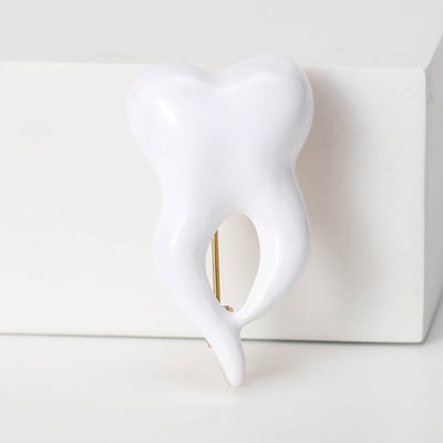 White Enamel Tooth brooch front view on a white background