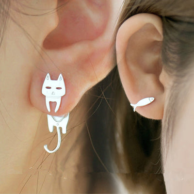 Silver cat stud with hanging tail and fish stud worn on two ears