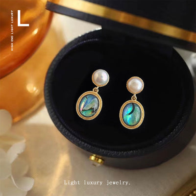 Pearl stud abalone oval drops in open black jewelry box