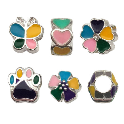 Colorful bead charms arranged on a light background