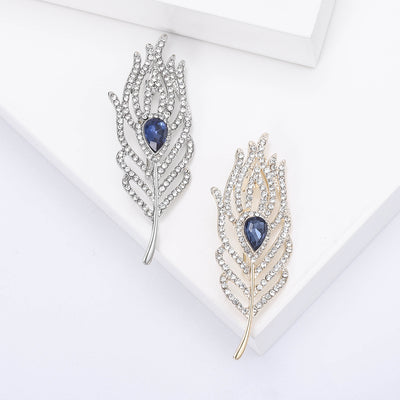 Main front view of Silver Tone Crystal Feather Brooch With Blue Teardrop Gem
