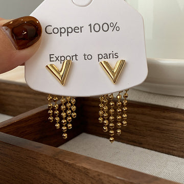 Gold V Shaped Beaded Tassel Stud Earrings with Polished Metal Details