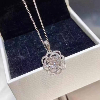 Silver flower CZ pendant necklace in white box with dark velvet lining