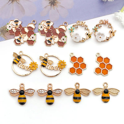 Colorful bee charms arranged on a light background