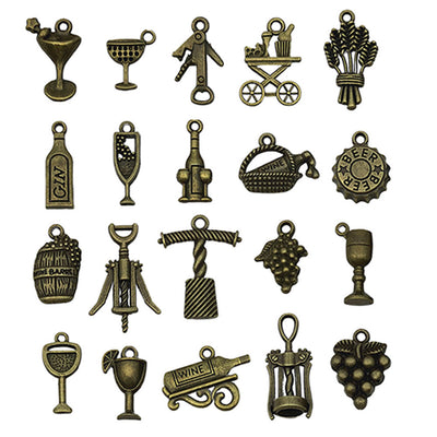 Gold-tone assorted shape charms arranged on a light background