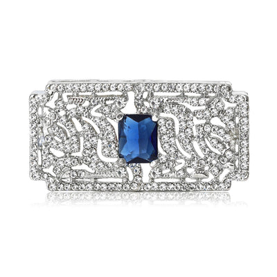 A textured crystal rectangle centered by a colored rectangular stone shown on a white background