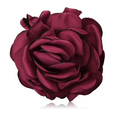 Product display showing a layered satin rose with softly curled fabric petals