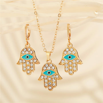 Gold Tone Crystal Hamsa Evil Eye Pendant Necklace and Huggie Earrings
