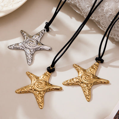 Grouped style view of long black cord starfish pendant necklaces in main image 1.