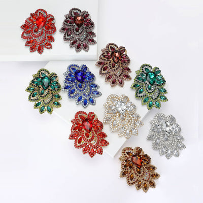 Front view of an ornate teardrop cluster of faceted stones and crystals